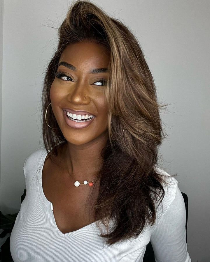 Stylish dark brown women's lace front wig featuring blonde highlights and a flowing natural wave.