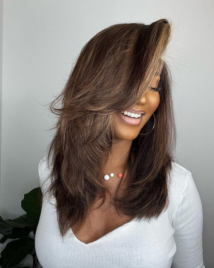 Elegant natural wave highlighted human hair wig for women. Dark brown base with blonde strands. Lace front.