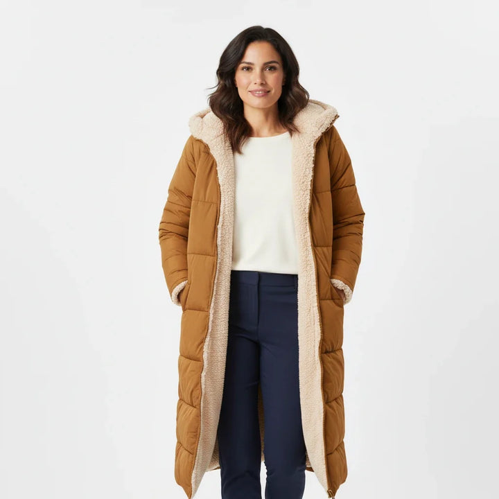 Women's hooded puffer jacket, cozy winter warmth, long insulated coat for cold weather.