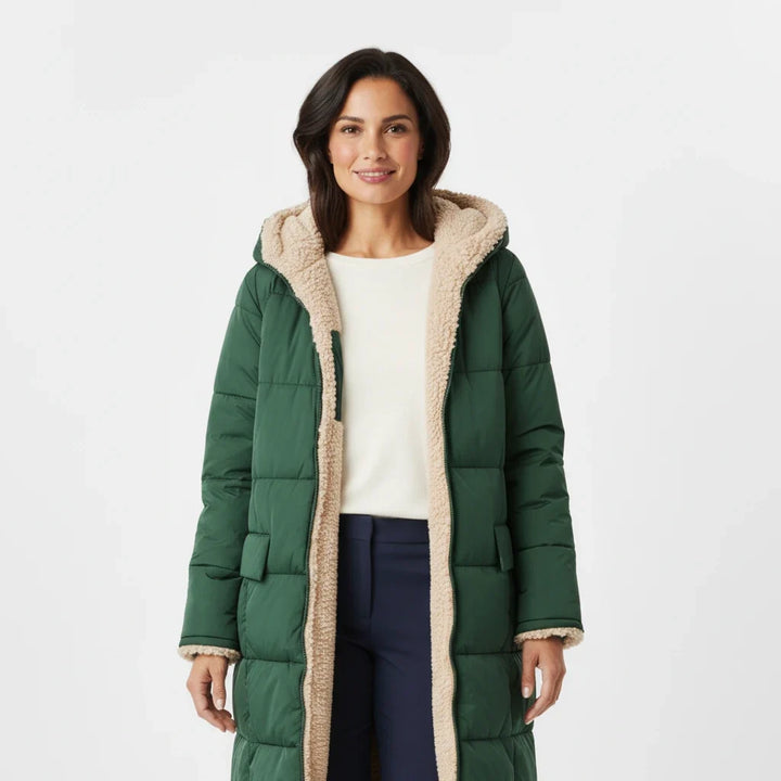 Quilted women's hooded jacket, a warm puffer coat for cozy winter outfits.