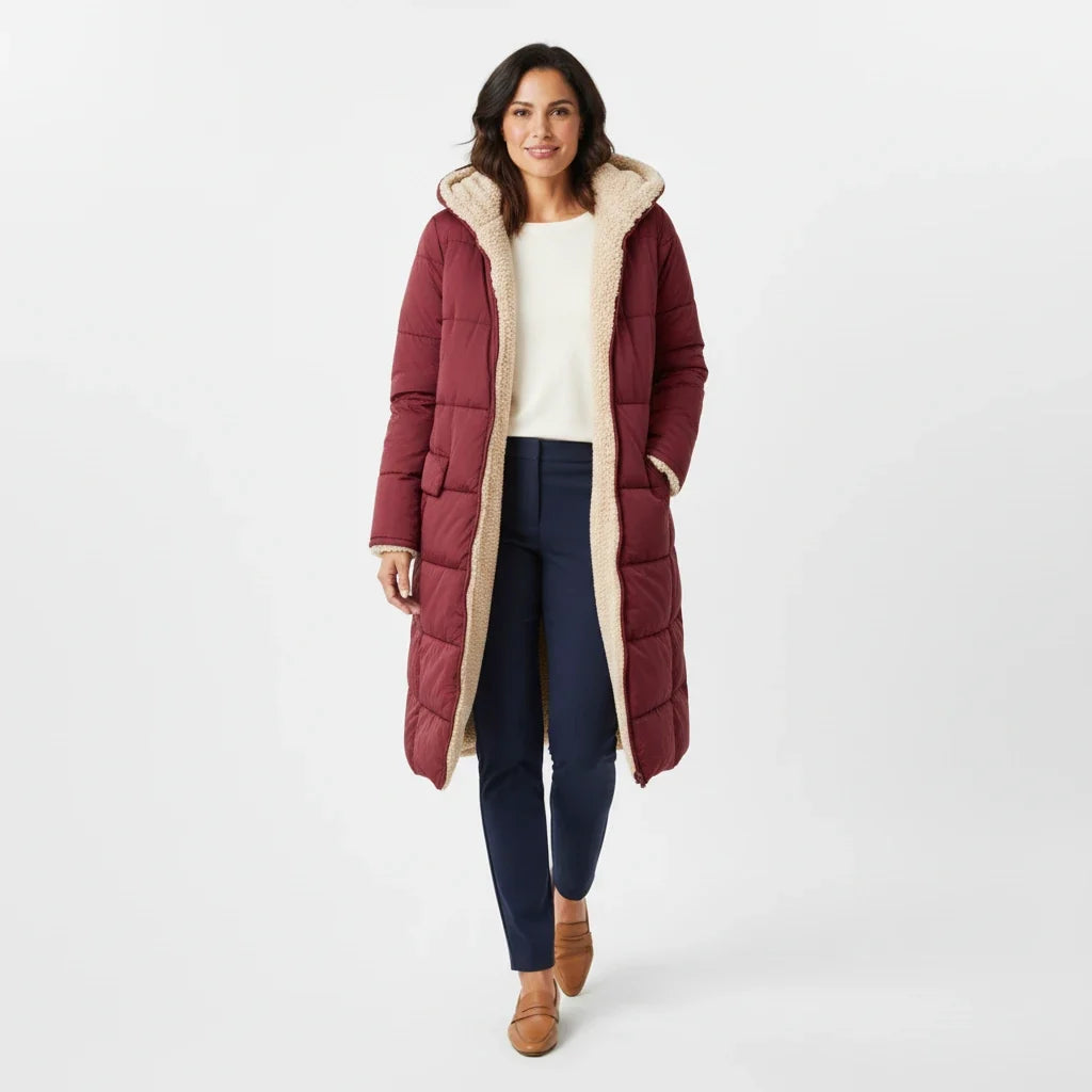 Women's hooded long puffer, insulated for cozy winter warmth and fashion.