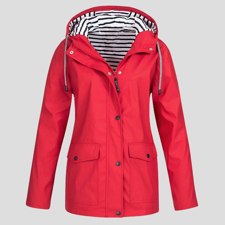 Women's hooded waterproof rain jacket featuring convenient front pockets. Stylish, lightweight design for women.