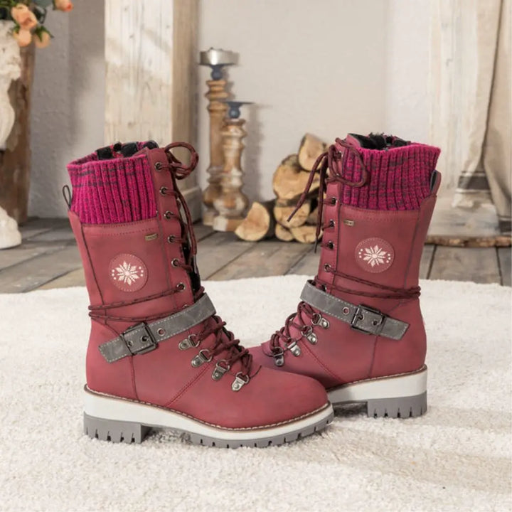 Close-up of women's insulated snow boots, waterproof material, secure lacing