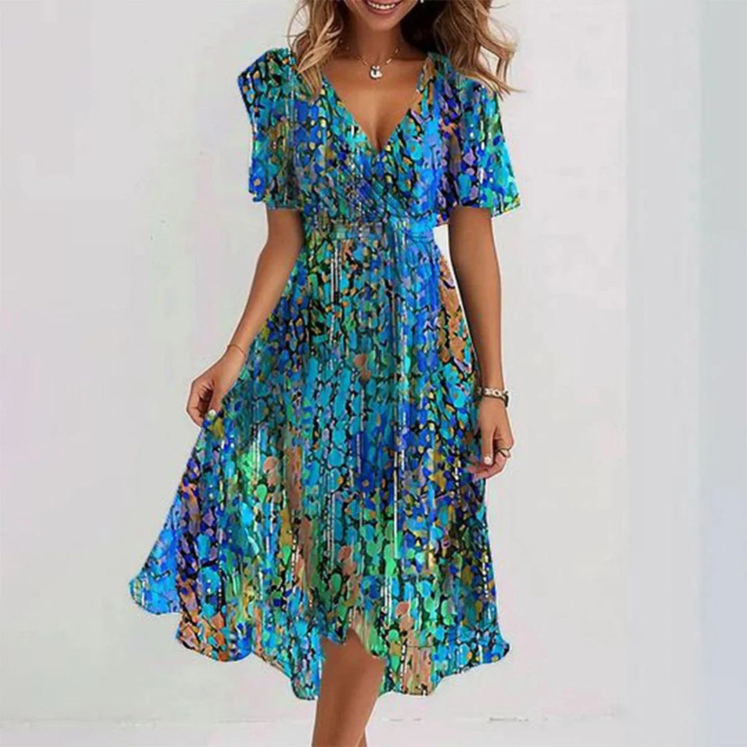 Close-up of Juniper vibrant abstract print midi dress, showcasing colorful elegant pattern and wrap style.