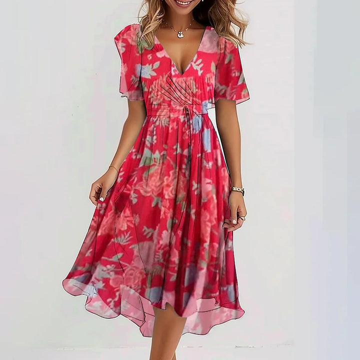 Modest wrap midi dress for women, with vibrant abstract print, suitable for elegant day or party wear.