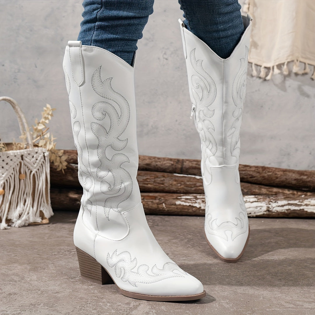 Statement women's cowboy boots, knee-high design with bold block heel.