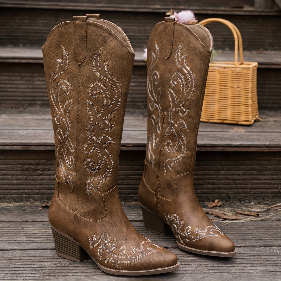 Ladies' knee-high cowboy boots with block heel, combining comfort & style.