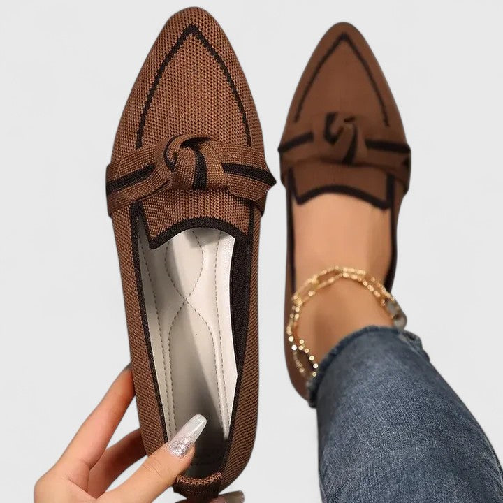 Stylish women's tan pointed-toe flat loafers with a decorative knot, offering comfort and a chic look.
