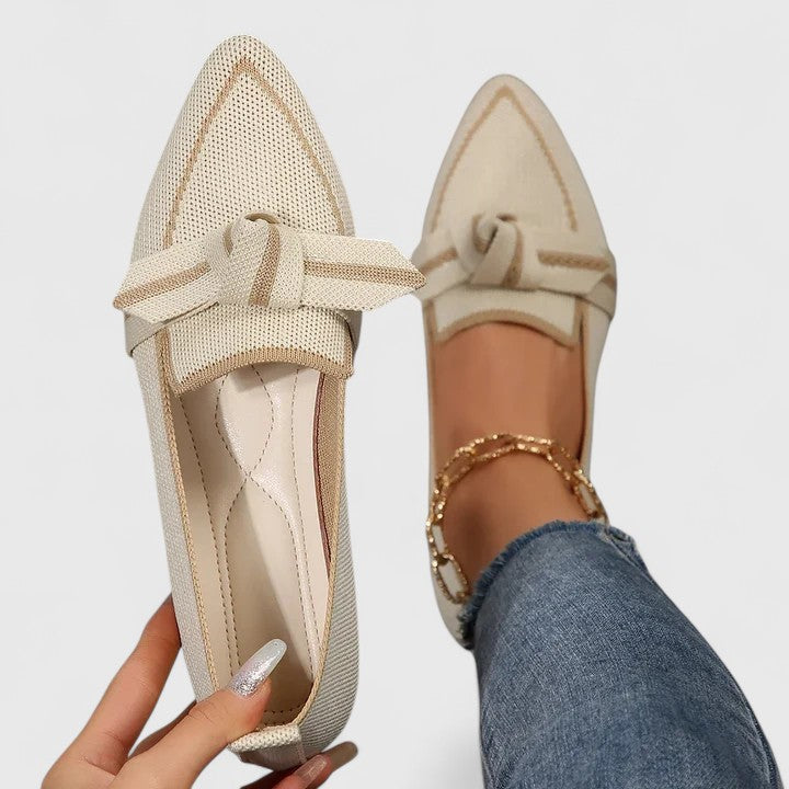 Effortless chic women's slip-on pointed-toe flat loafers with knot detail, great for fashion-forward footwear.