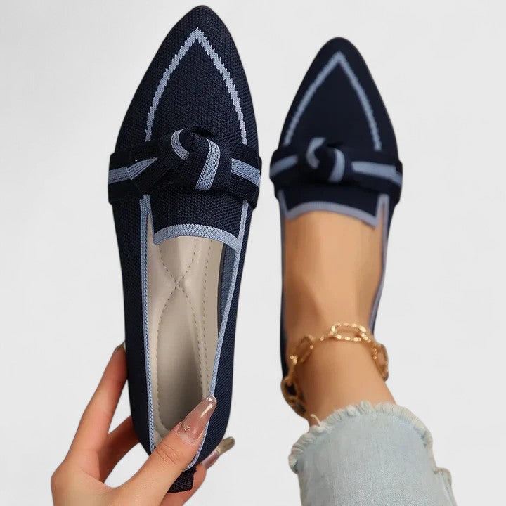 Elegant women's pointed-toe flat loafers with a stylish knot front, offering comfortable and chic footwear for any event.