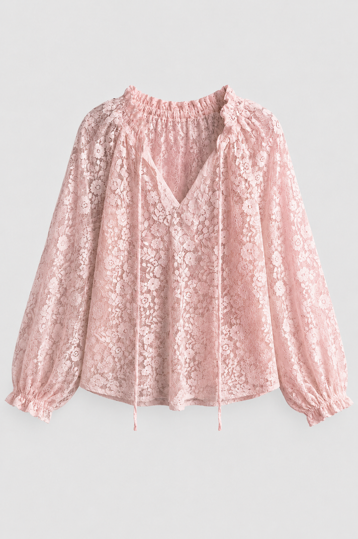 Women's lace detail blouse with a tied neckline, long sleeves, ideal for casual or semi-formal wear.