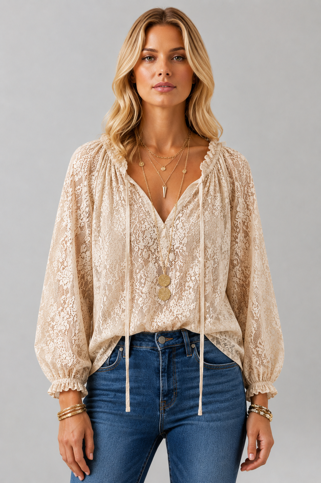 Elegant women's long sleeve lace top with a tied neckline, perfect for a refined look.