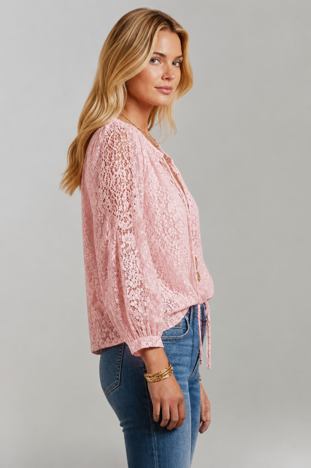 Women's white lace detail blouse with a tied neckline and long sleeves, a stylish everyday top.