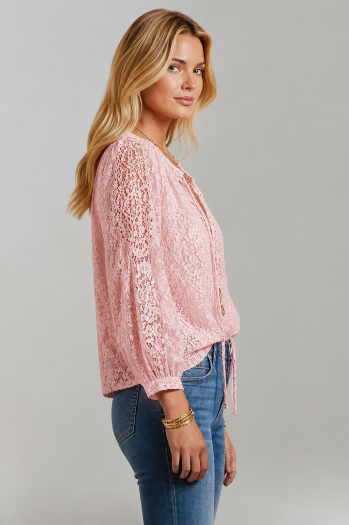 Women's white lace detail blouse with a tied neckline and long sleeves, a stylish everyday top.