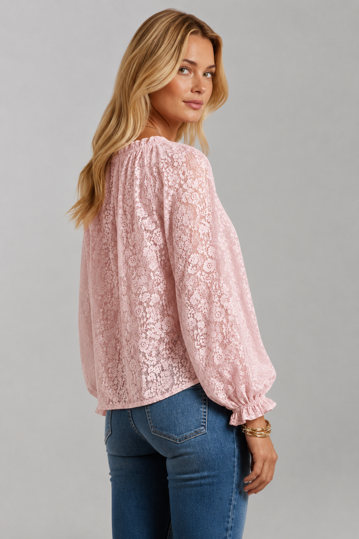 Comfortable loose fit black lace blouse for women, featuring a trendy tied neckline and long sleeves.