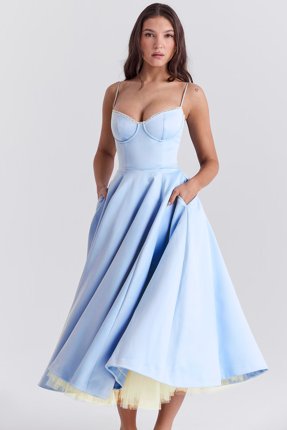 Flattering women's midi dress, sleeveless, featuring a lace-trim corset bodice and practical pockets. Perfect for parties.