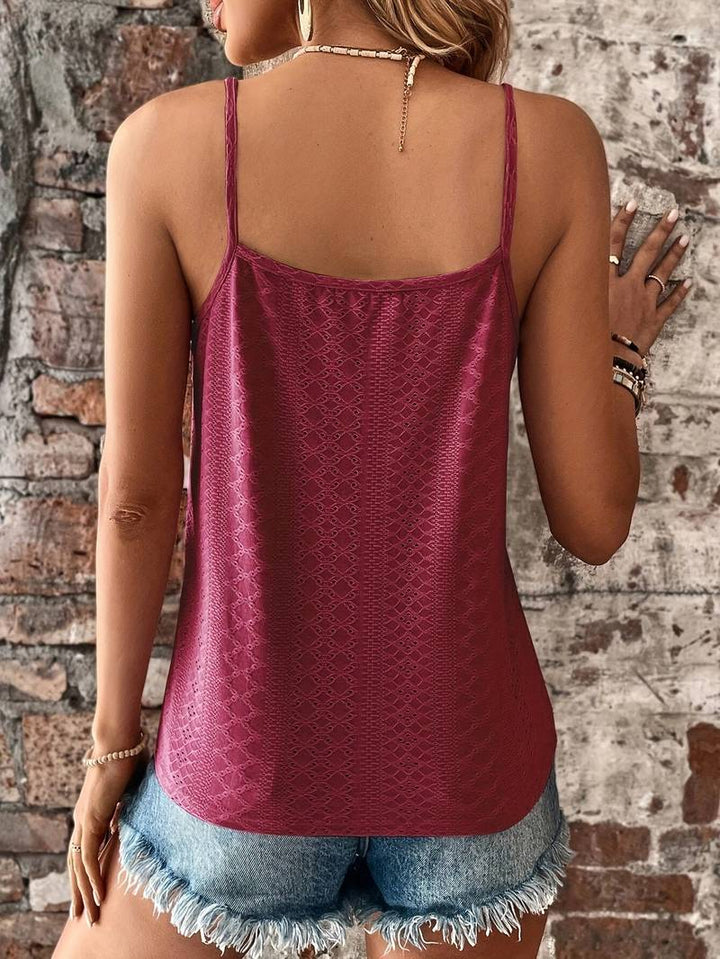 Woman modeling a chic lace trim v-neck cami top, showcasing its elegant summer fashion.