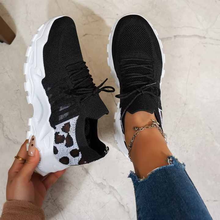 Supportive women's lace-up sneakers, specifically designed for orthopedic comfort and active wear.