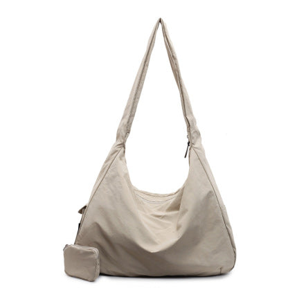 Front view of a women's large capacity casual crossbody bag in black, with adjustable shoulder strap.