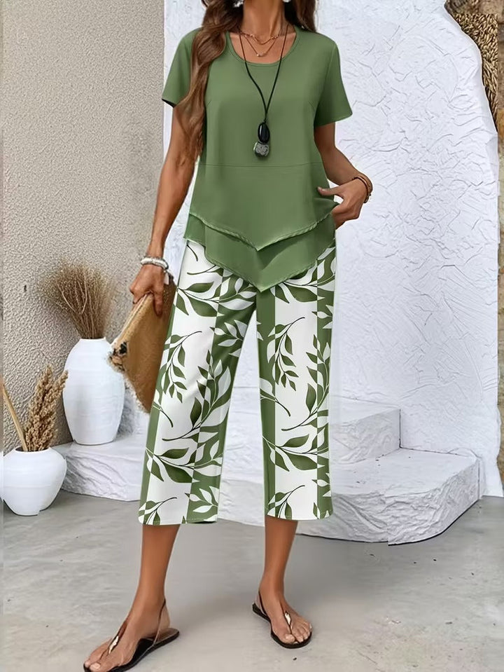 Women's leaf print two-piece outfit. Botanical summer fashion, elegant & relaxed fit short sleeve top & pants set.
