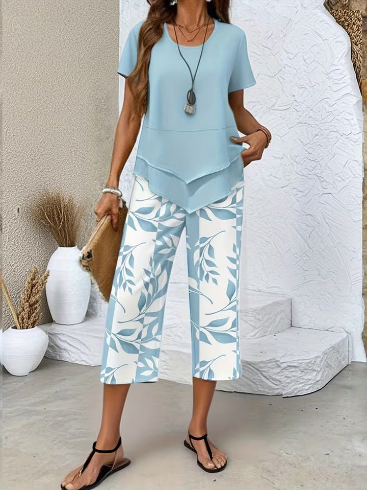 Short sleeve top & wide-leg pants set with botanical leaf print for women. Casual summer fashion, two-piece outfit.