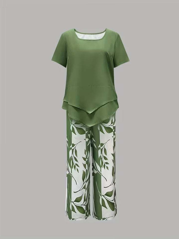 Stylish women's botanical leaf print two-piece outfit. Short sleeve top and relaxed fit pants set.