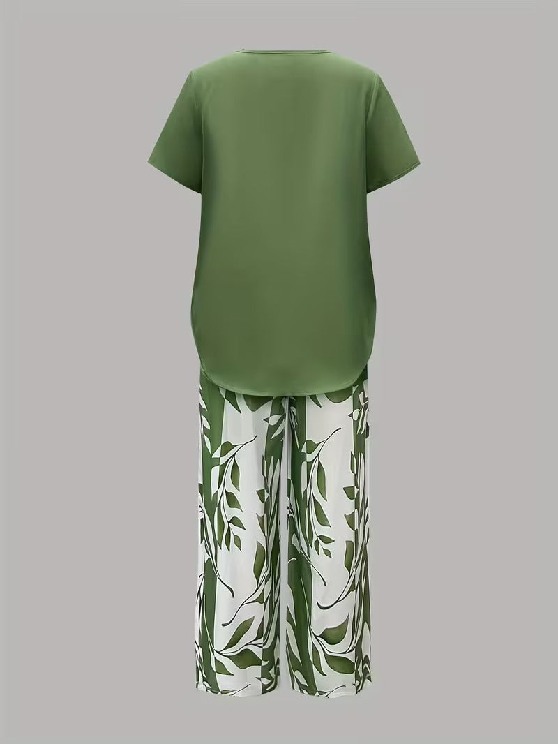 Elegant women's two-piece set featuring a botanical leaf print, short sleeves, and comfortable pants for summer.