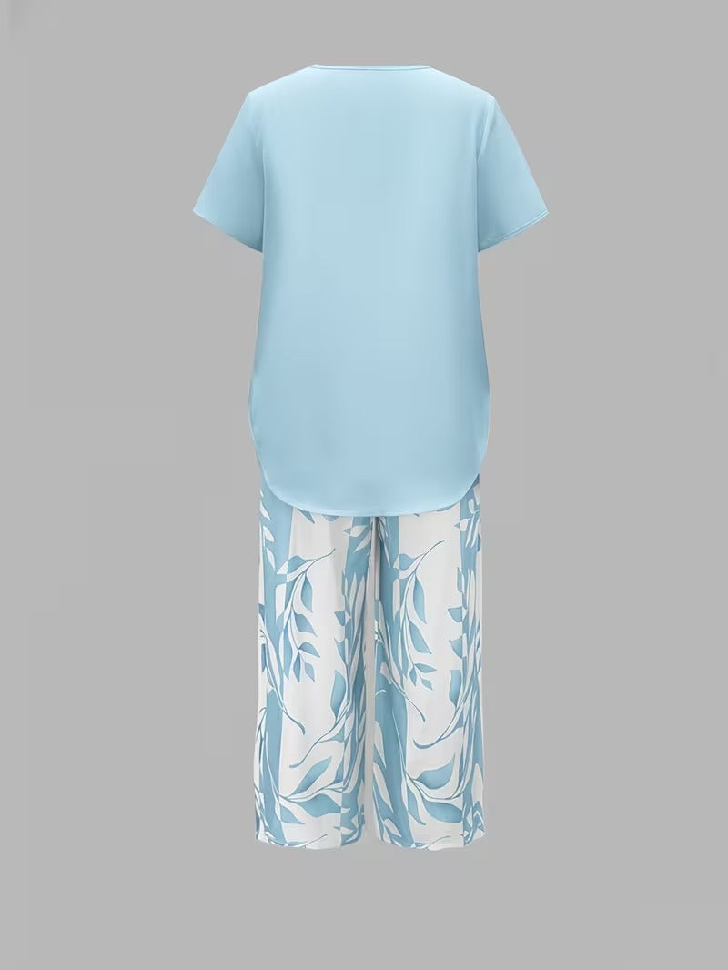 Stylish women's botanical leaf print pants set. Elegant short sleeve top & wide-leg pants for summer casual wear.