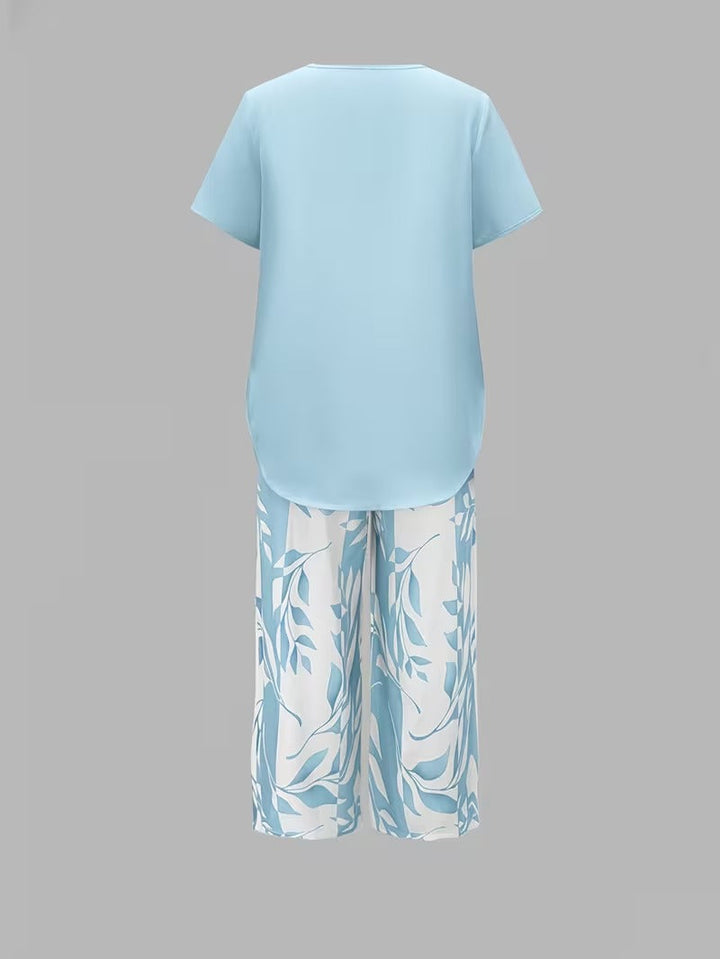 Stylish women's botanical leaf print pants set. Elegant short sleeve top & wide-leg pants for summer casual wear.