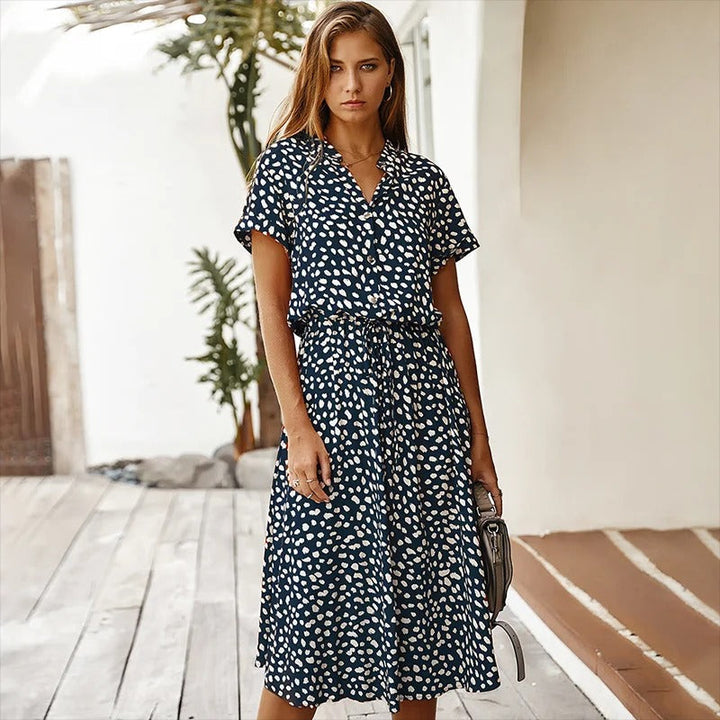 Casual women's leopard print midi shirt dress featuring a sophisticated belt, perfect for spring.