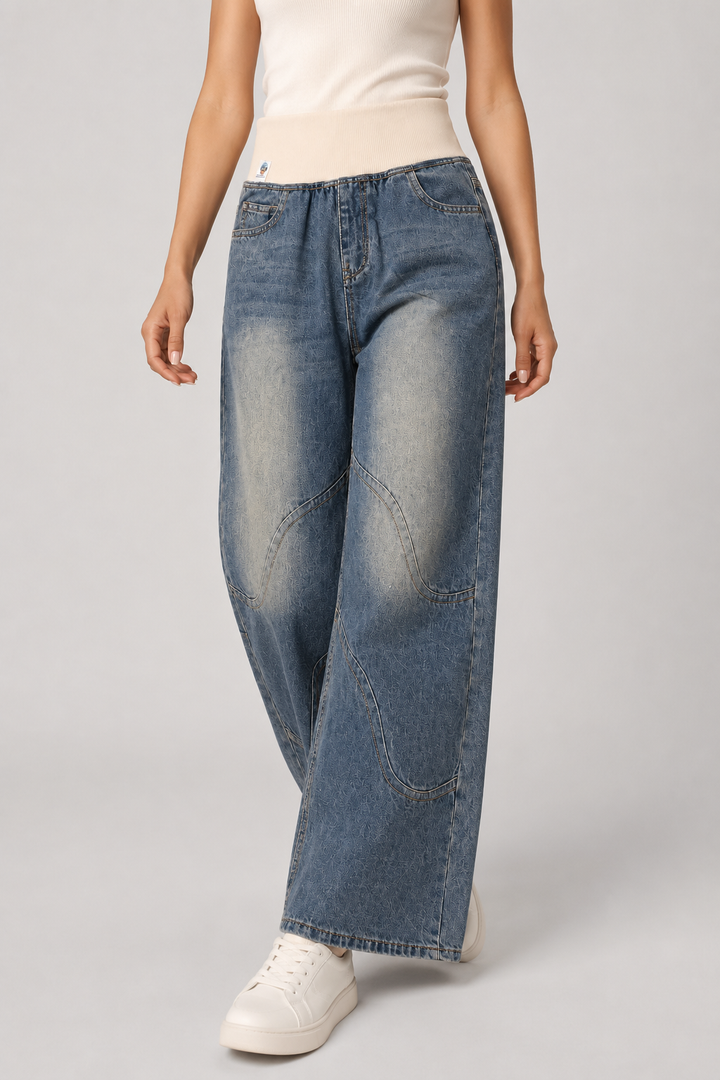 Stylish women's light blue wide leg jeans, featuring a trendy loose fit for a relaxed and fashionable look.