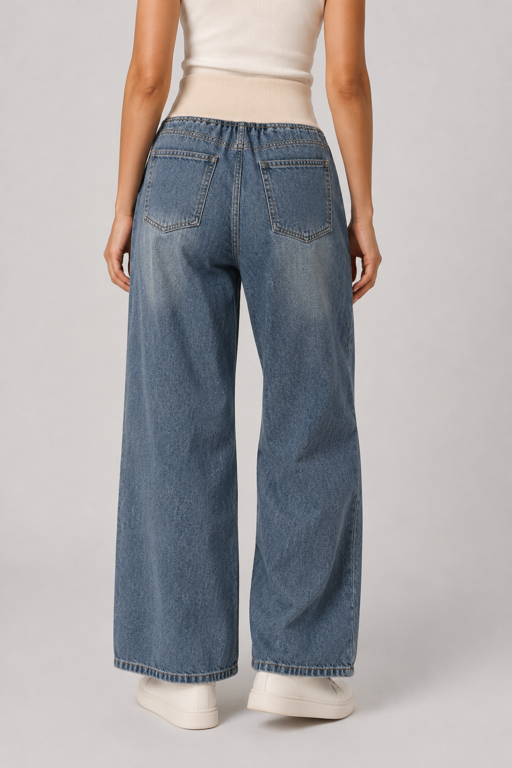 Comfortable light blue women's wide leg jeans, offering a loose fit for relaxed casual wear & modern fashion.