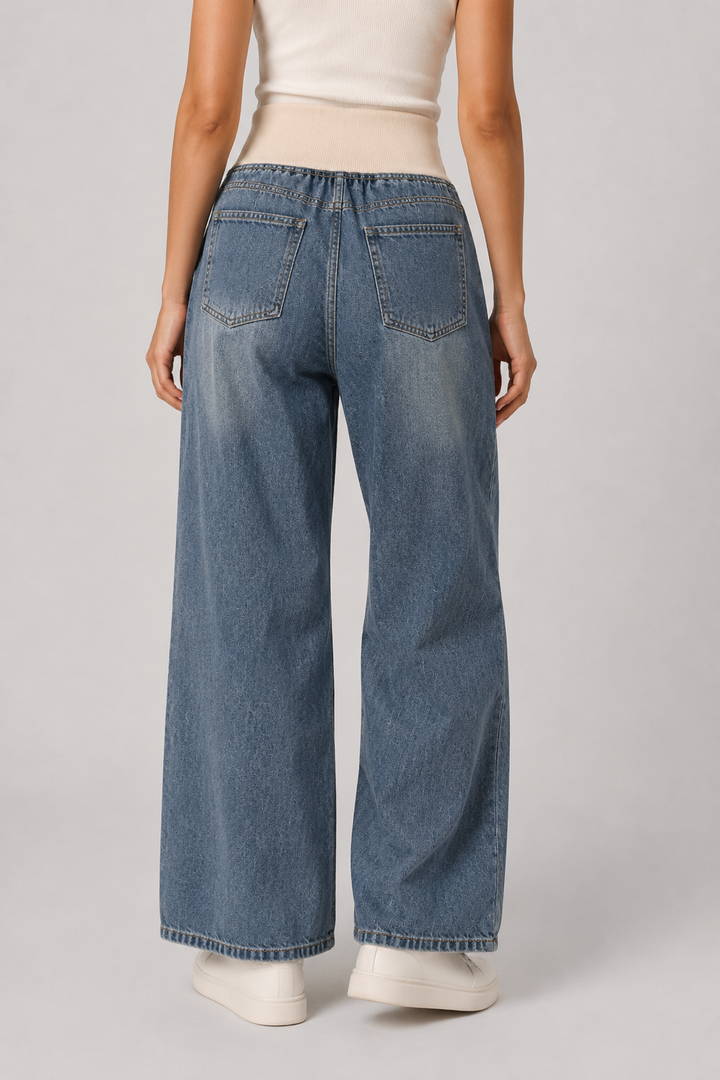 Comfortable light blue women's wide leg jeans, offering a loose fit for relaxed casual wear & modern fashion.