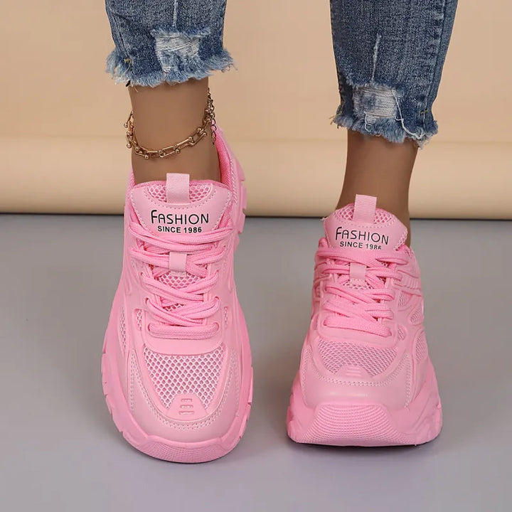 Comfortable lace-up women's walking shoes. Breathable, lightweight design for daily athletic wear.