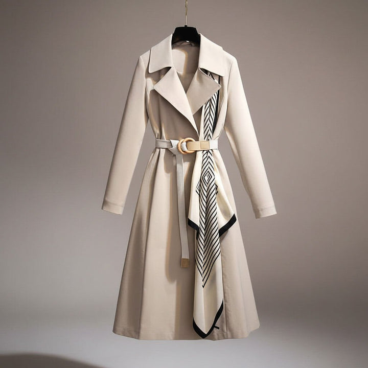 Close-up of a women's belted trench coat showing the stylish scarf detail. Lightweight, elegant fashion outerwear.