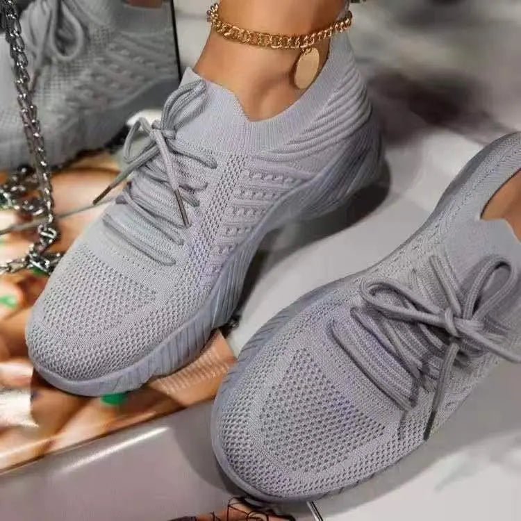 Comfortable women's athletic sneakers featuring a breathable design and reliable non-slip grip.