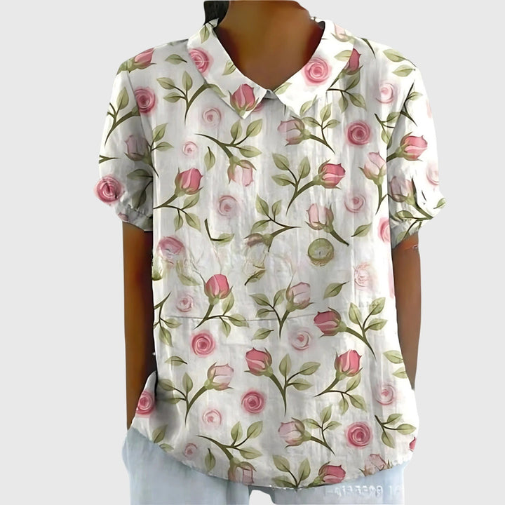 Elegant neckline of a women's floral blouse, designed for a relaxed, comfortable fit and casual wear.