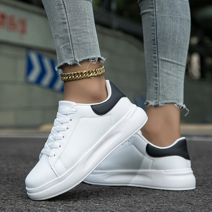 Woman wearing lightweight orthopedic sneakers, showcasing ergonomic design for all-day comfort.