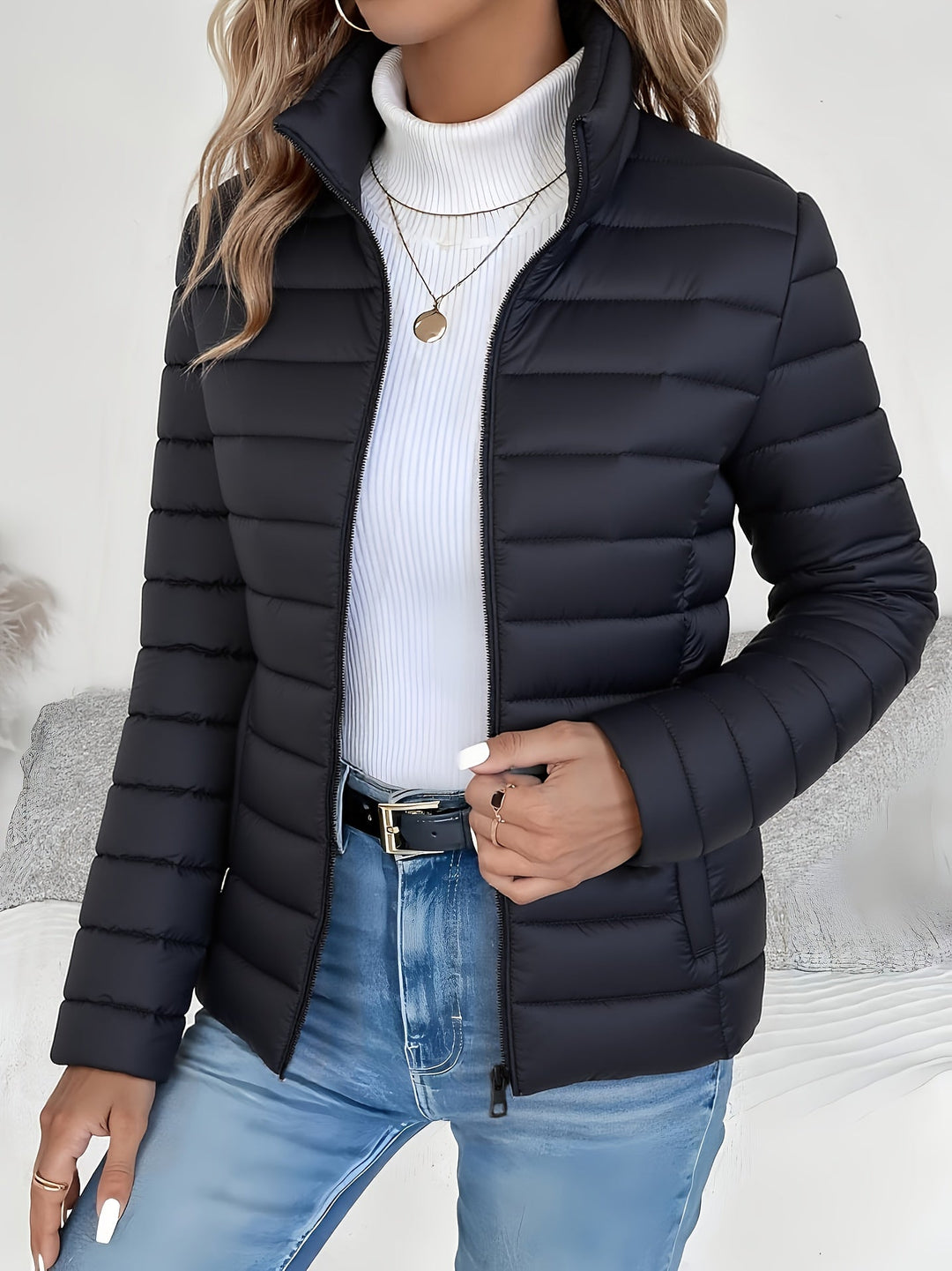 Warm women's puffer jacket, quilted design for cold weather. Comfortable and lightweight everyday outerwear.