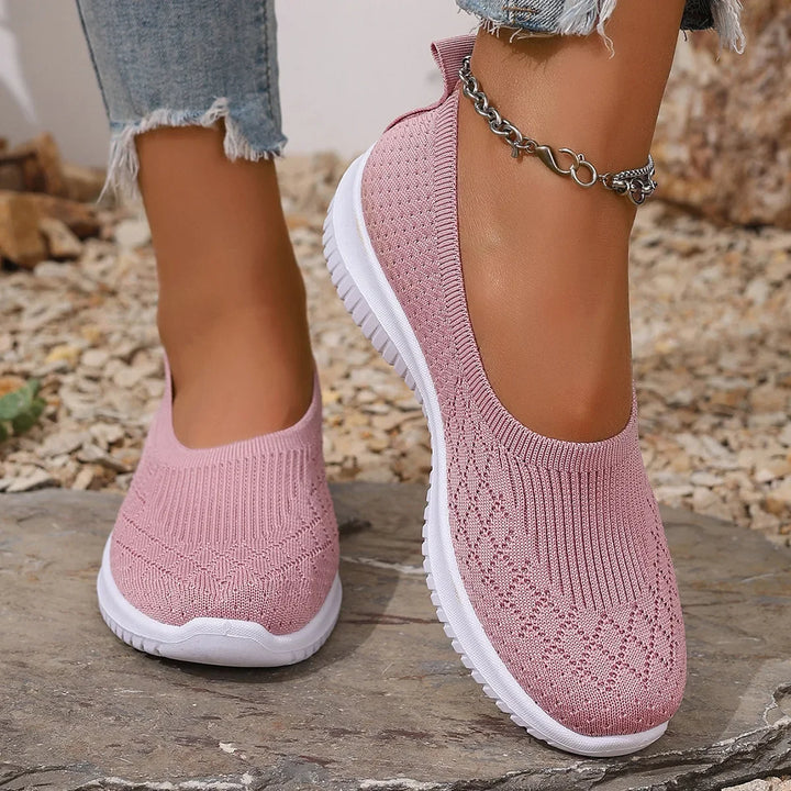 Side view of a women's lightweight slip-on sneaker, ideal for walking, travel, and casual wear.