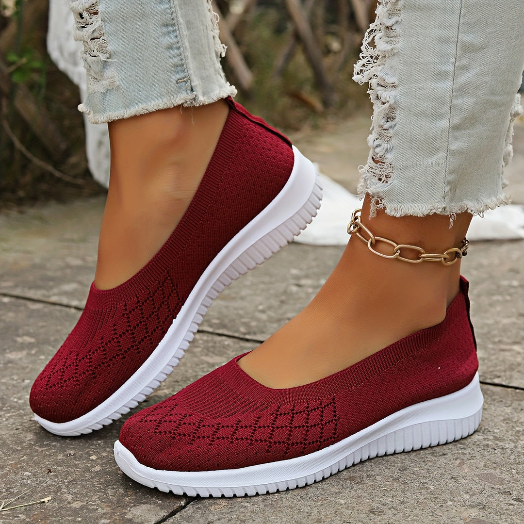 Close-up of a women's slip-on sneaker, showcasing its lightweight design and comfort features.