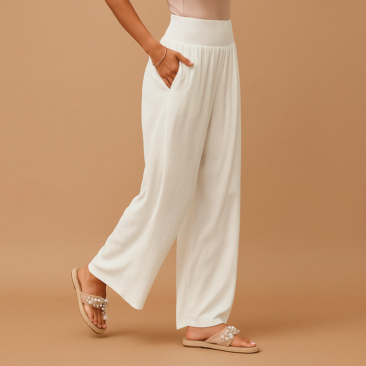 Breathable women's loose fit summer pants featuring an elastic waist. Ideal for casual, relaxed wear.