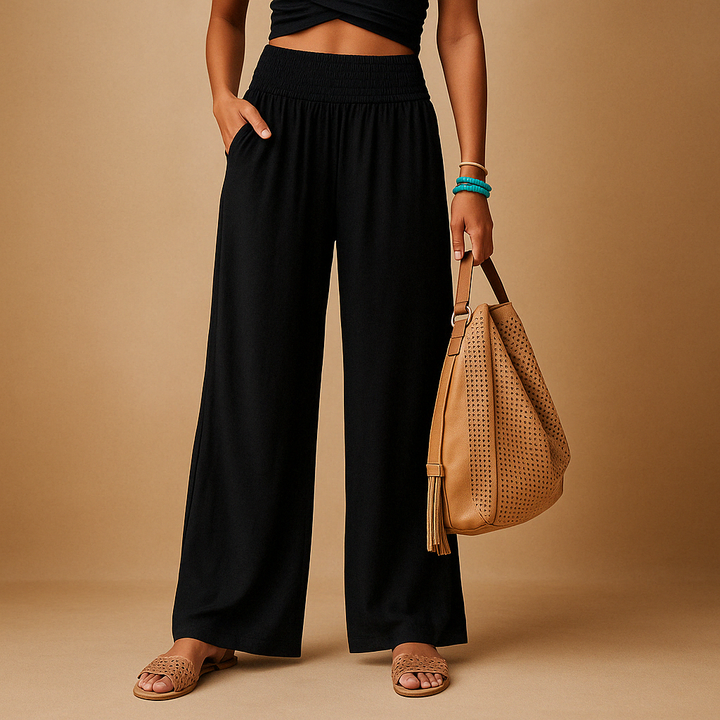 Women's lightweight summer trousers in a relaxed, loose fit. Breathable casual pants with elastic waist.