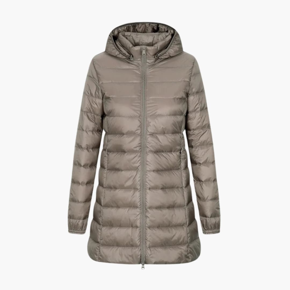 Warm women's long puffer jacket with hood, designed for extreme cold weather. Cozy quilted winter outerwear fashion.