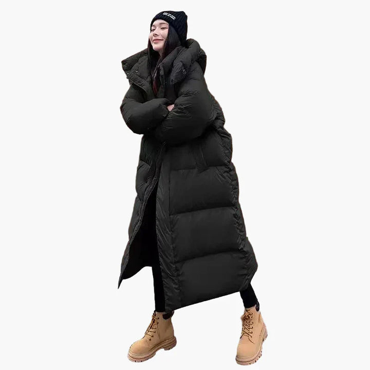 Back view of a women's long hooded puffer coat, showcasing its length and warmth for cold weather