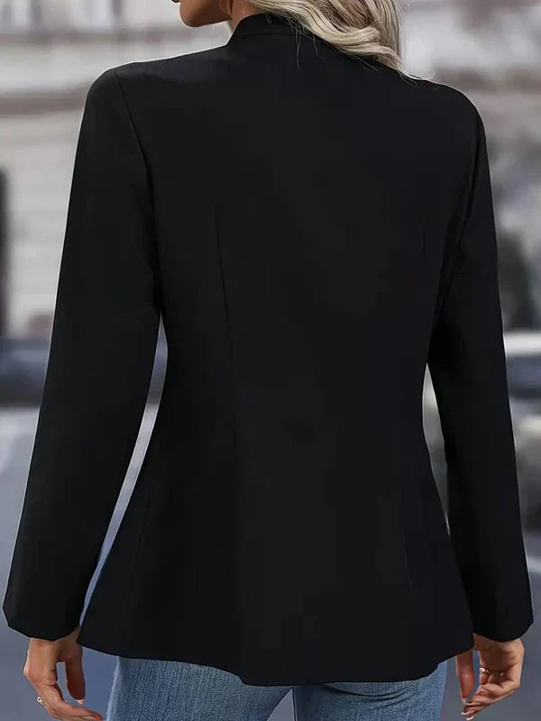 Classic women's long sleeve button-down blouse, military-inspired fashion statement.