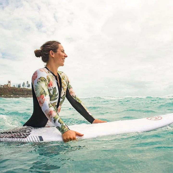 Women's full coverage long sleeve one-piece swimsuit with zipper, ideal for athletic beachwear & sun protection.