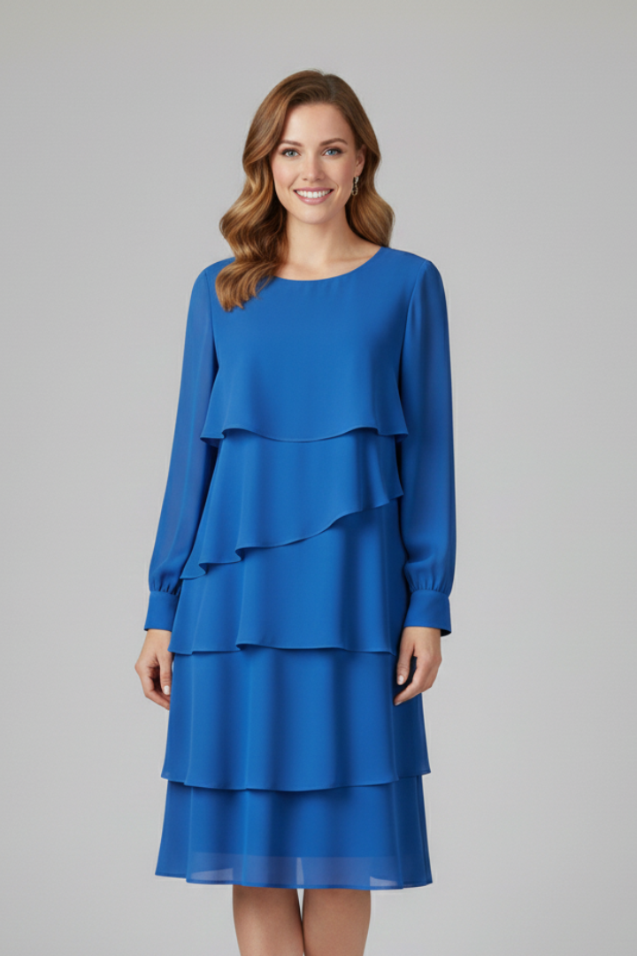 Model wears a trendy women's long sleeve tiered midi dress, showcasing its flattering flowy design.