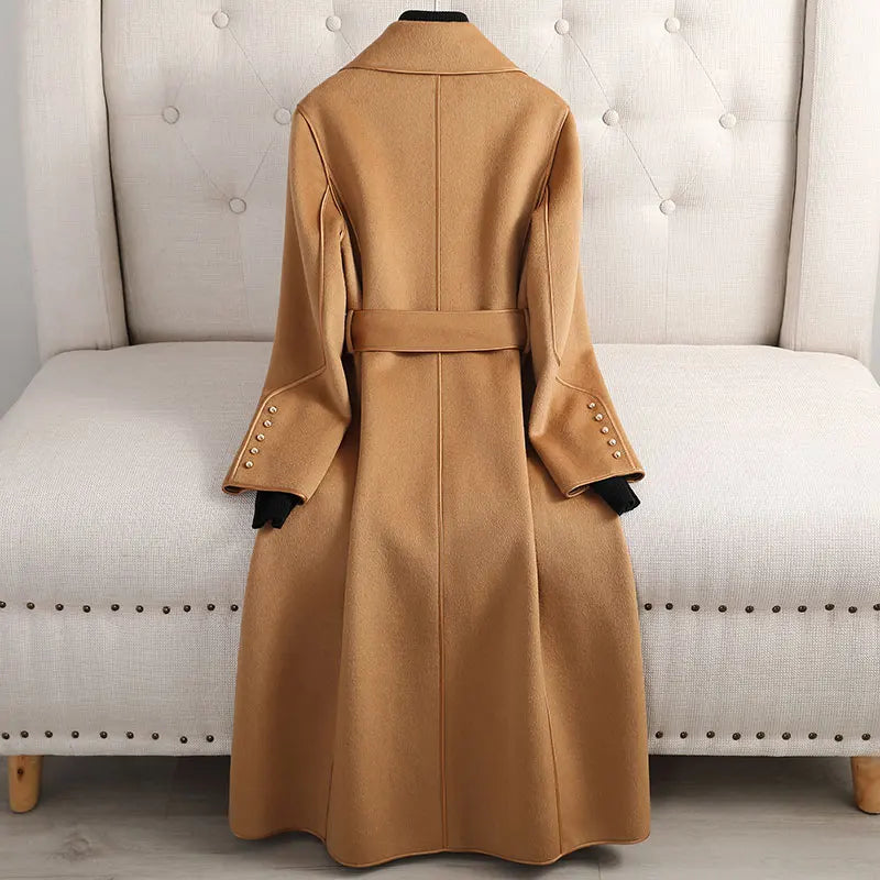 Chic women's belted trench coat, long & tailored. Versatile outerwear, perfect fall/spring jacket for ladies.