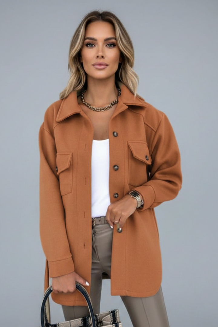 Women's straight-cut longline shirt jacket with chest pockets. Collared, button-front, versatile.